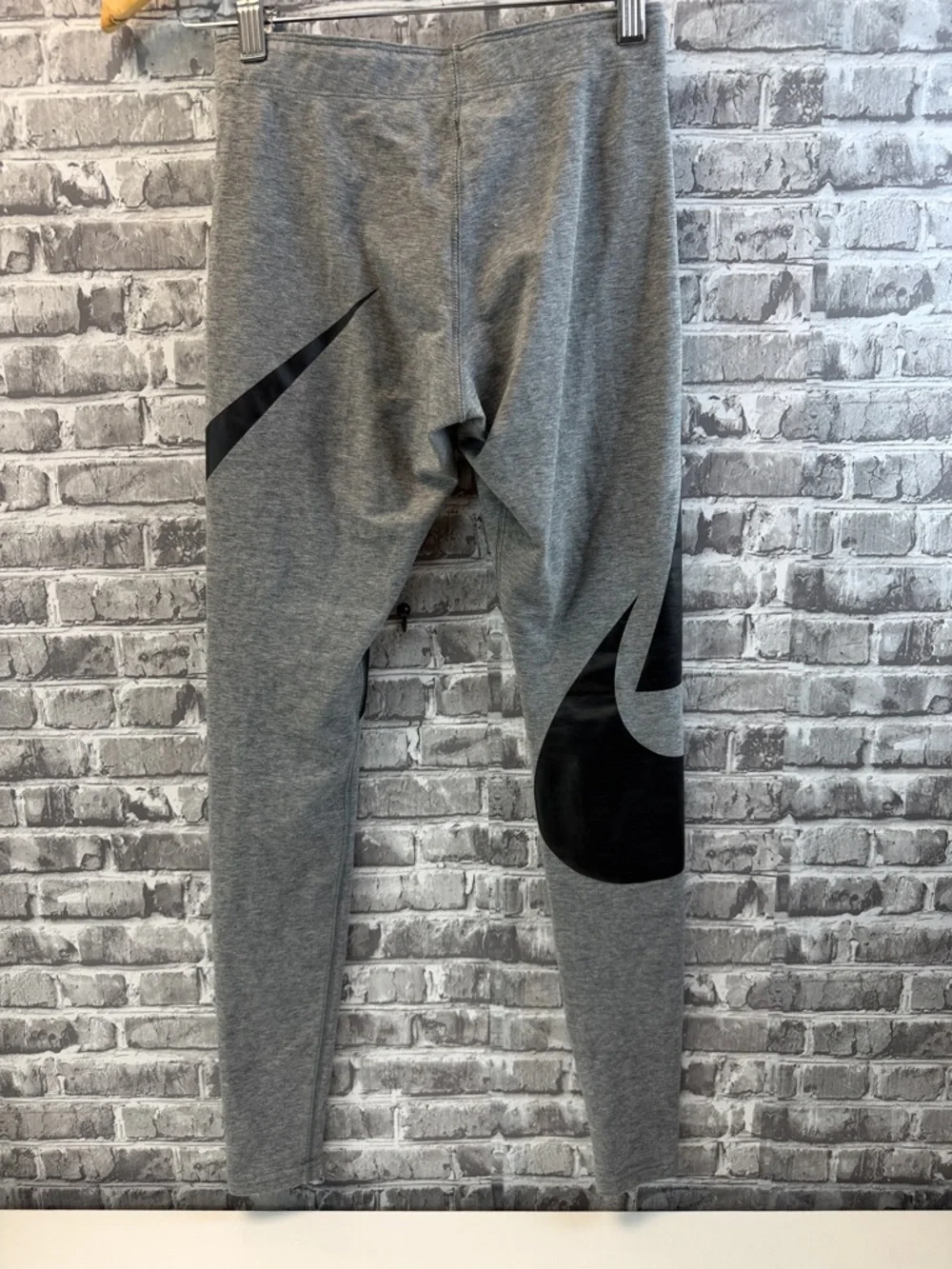 Nike Gray Athletic Leggings with Bold Black Graphic